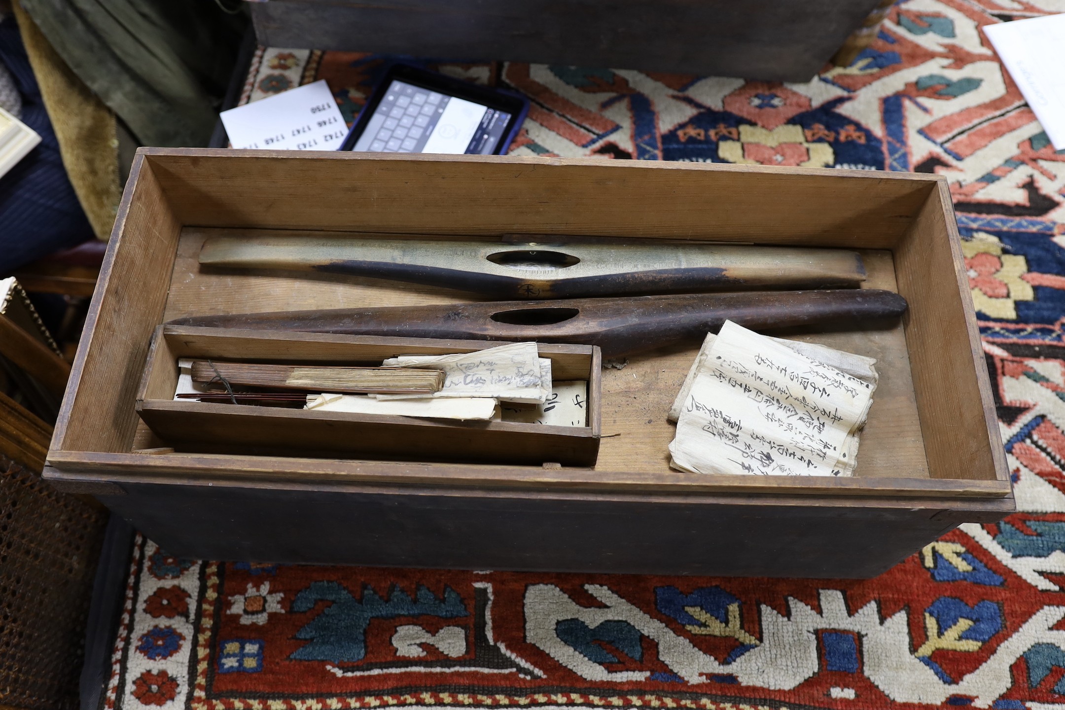 A Japanese, late 19th century / early 20th century, scribes box contains books, ink pots etc
